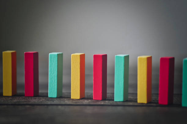 istock Background material with colorful dominoes lined up in a row 1481059702
