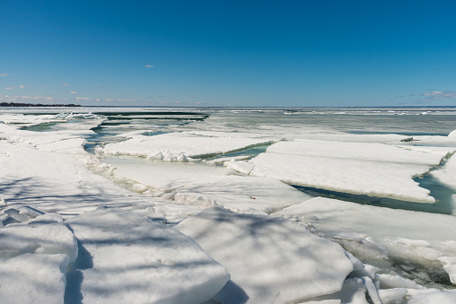 The ice on Lake Simcoe breaks up in spring time, forms ice dam along the shore line.