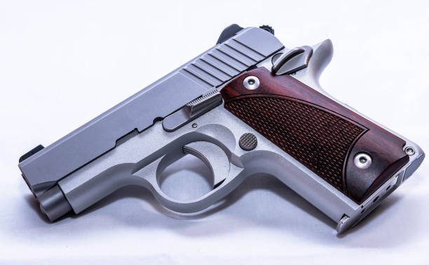 istock A small pistol with wooden grips 1481068317