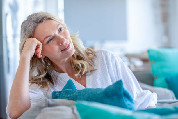 istock Mature woman relaxing on the sofa. 1481069801