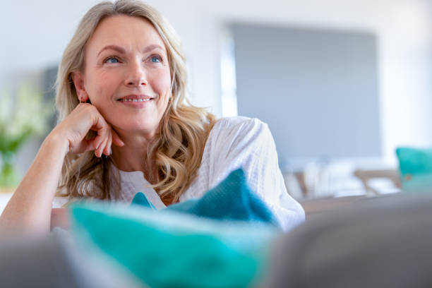 istock Mature woman relaxing on the sofa. 1481069813