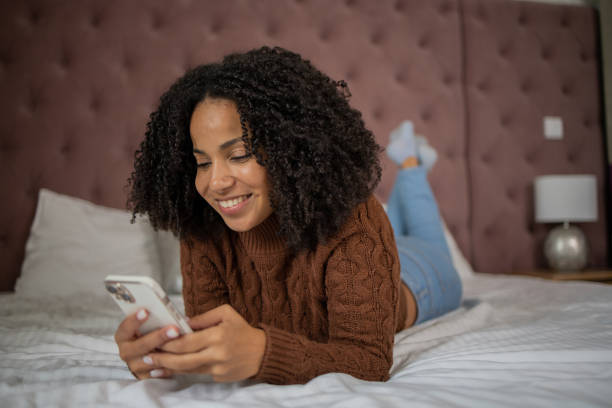 istock Happy young woman using phone 1481070680