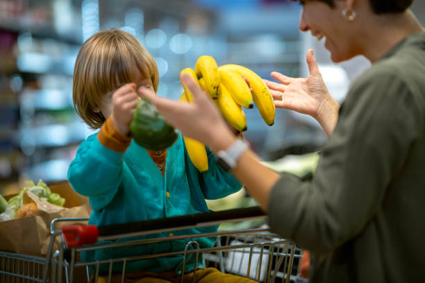 istock A mother with a child in a store with fresh vegetables 1481070806