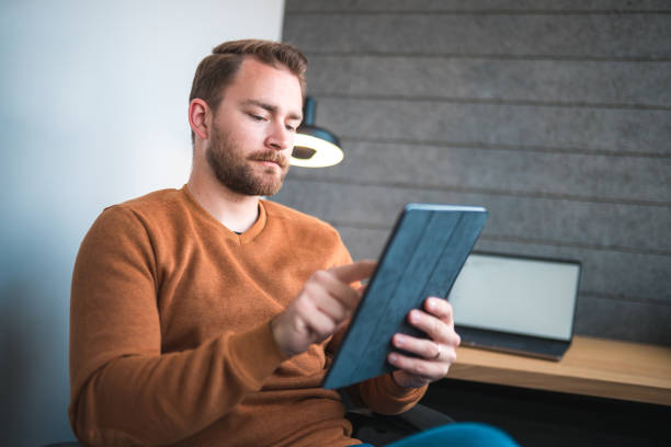 istock Caucasian Male Graphic Designer Working With A Digital Tablet 1481073199