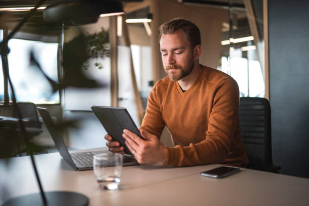 istock Handsome White Male Entrepreneur Working With A Digital Tablet 1481073234