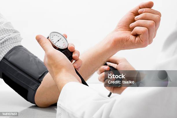 Blood Pressure Measuring Studio Shot Stock Photo - Download Image Now - Hypertensive, Adult, Doctor