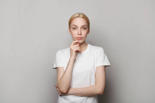 istock Serious woman thinking on grey background, studio portrait 1481077169