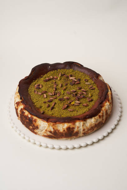 istock Pistachio cheesecake on a white background 1481082901