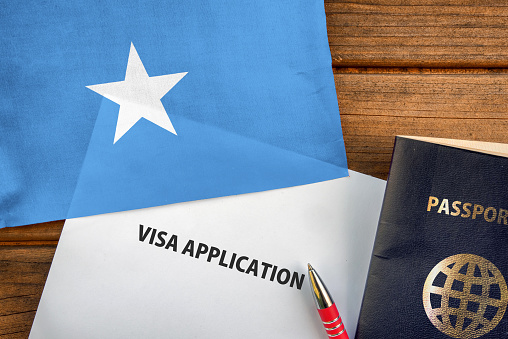 Visa application form, passport and flag of Somalia
