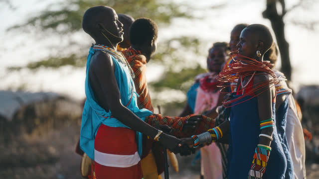 SLO MO Samburu couples in local dresses performs tribal songs