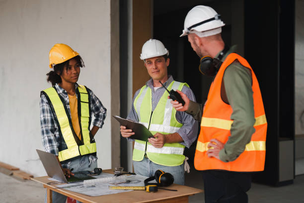 istock Engineer and Foreman builder team at construction site. American African foreman construction standing at construction site 1481104680