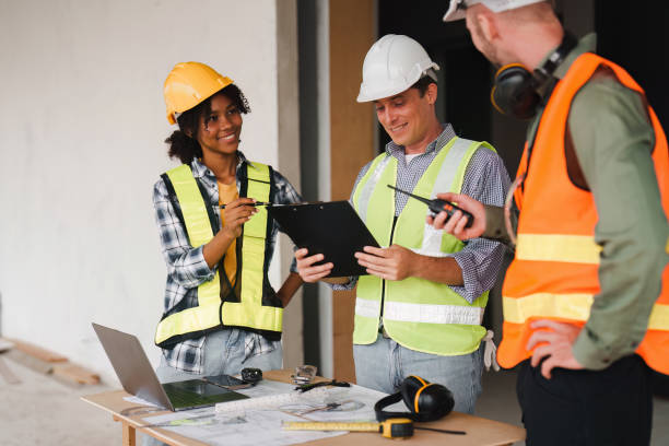 istock Engineer and Foreman builder team at construction site. American African foreman construction standing at construction site 1481104894