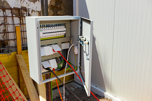 Fuse box, control panel with automatic fuses and sockets, electrical control panel enclosure for power and distribution electricity on the building site.
