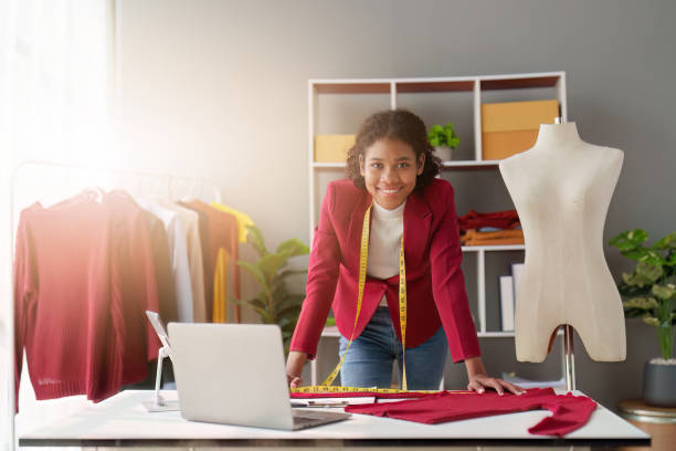 istock American African Fashion designer working in studio with laptop computer 1481105056