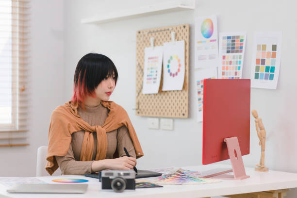 istock A creative and stylish young female freelance designer is using a tablet and stylus pen while sitting at her desk in her home office. 1481107371