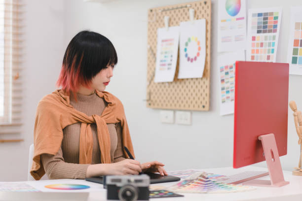 istock A creative and stylish young female freelance designer is using a tablet and stylus pen while sitting at her desk in office. 1481107375