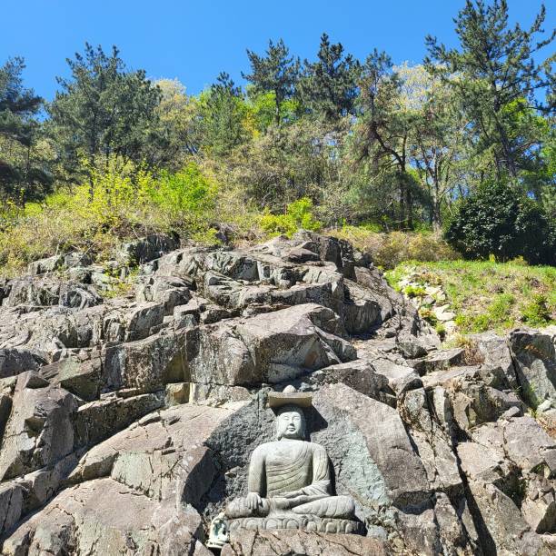 istock Korean Buddhist statues carved on rocks 1481108194