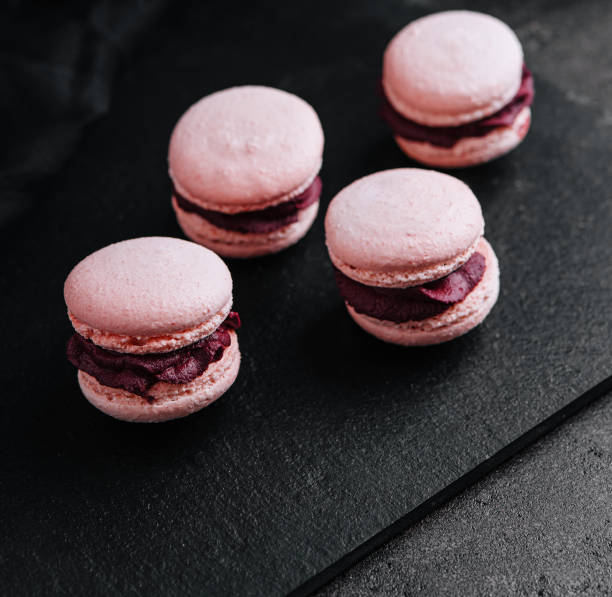 istock macarons with chocolate filling on black stone 1481108585