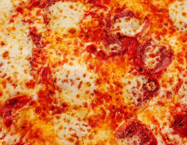istock pizza with salami, parmesan cheese background 1481109279
