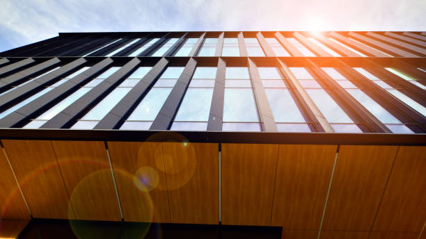 istock Glass modern building with blue sky background. Low angle view and architecture details. 1481109527