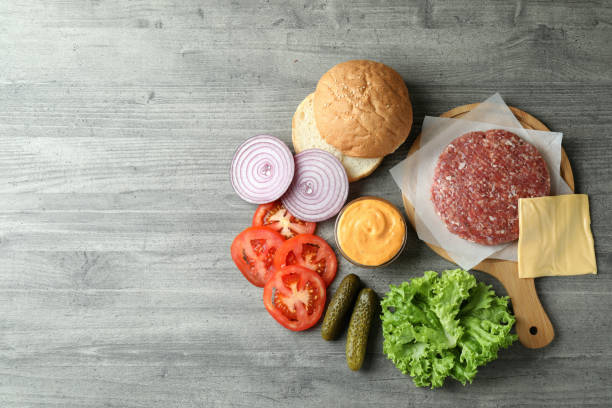 istock Concept of cooking burger on gray textured table 1481114053