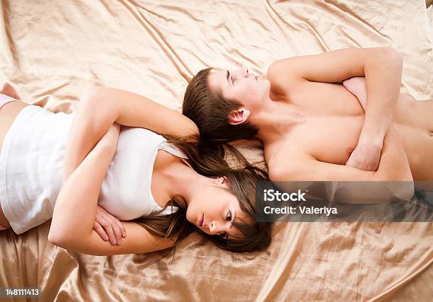 Upset Couple Sleeping Separately On Their Bed Stock Photo - Download Image Now - Adult, Adults Only, Anger