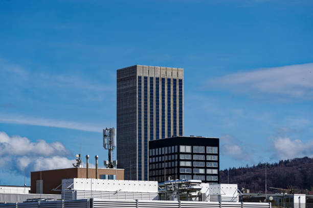 Scenic view of skyline of Industrial district of City of Zürich with grain silo tower on a blue cloudy winter noon. Photo taken March 9th, 2023, Zurich, Switzerland.