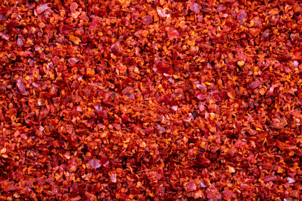 istock Dried red pepper flakes close-up. Spices and herbs. Chilli pepper seedless flakes background. 1481116822