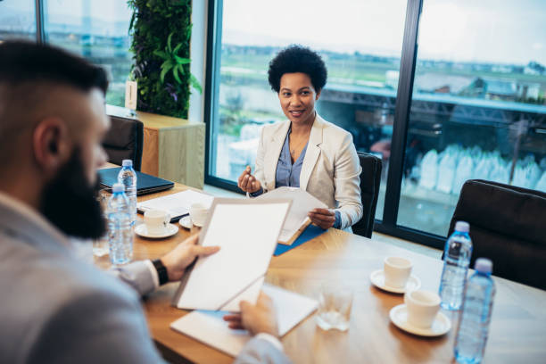 istock Group of businesspeople having a briefing in a boardroom. 1481118094
