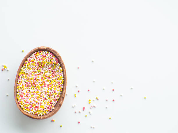 istock Chocolate easter egg with sweet sprinkles on white background 1481118624