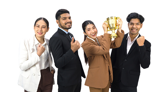 Team of successful young people standing together with trophy received from the work done proudly. Portrait on white background with studio light.