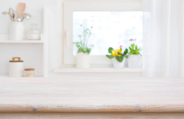 istock Kitchen table top on blur window sill and shelf background 1481118790