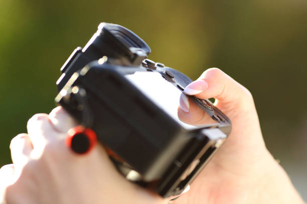 istock Close up of a photographer hand setting camera 1481122541