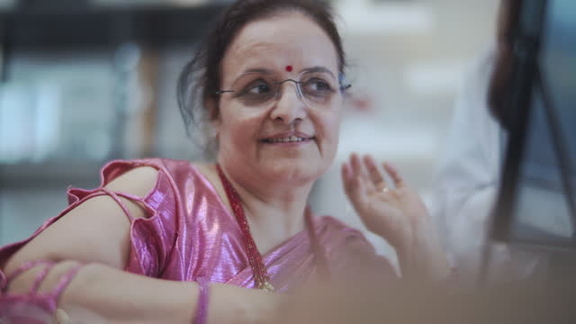 Indian woman in eyeglasses shop