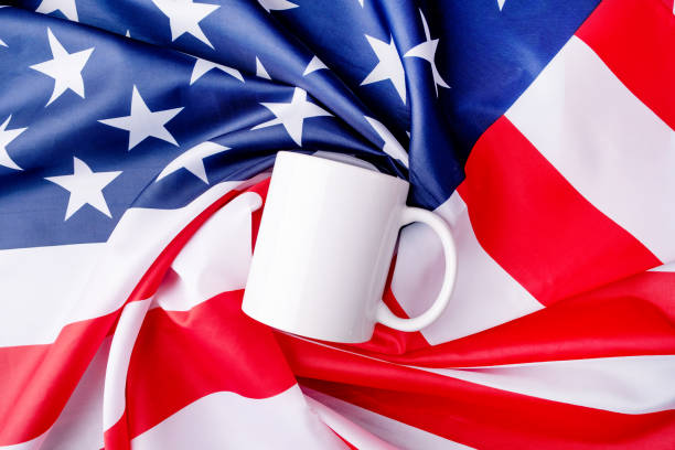 istock Blank white cup for mockup design over USA flag background 1481126931