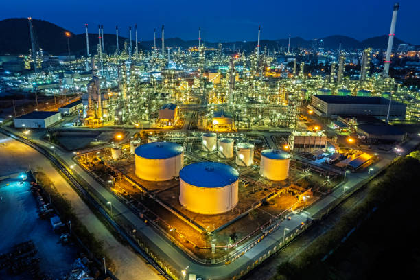 istock Refinery factory oil storage tank at night. 1481127449