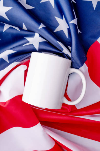 istock Blank white cup for mockup design over USA flag background 1481127862