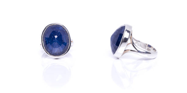 istock Blue Sapphire ring on white background with reflection. Collection of natural gemstones accessories. Studio shot 1481130883