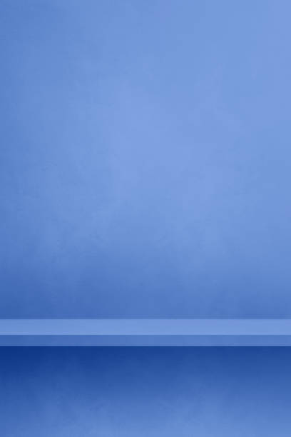 istock Empty shelf on a lilac blue concrete wall. Background template. Vertical mockup 1481130966
