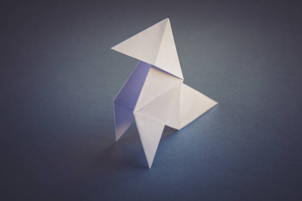 istock White paper hen origami isolated on a grey background 1481131293