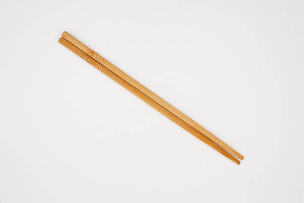 istock Pair of brown wooden chopsticks 1481133156
