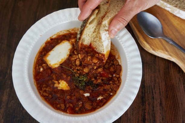 delicious meal: spicy gravy and homemade bread stock photo