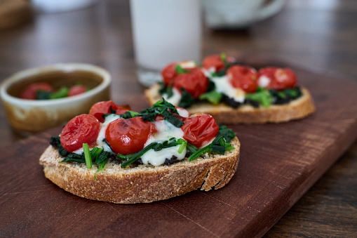 Delicious Brunch Toast, topped with tomato, spinach and cheese