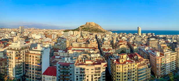 Alicante panoramic view from above with Santa Barbara hill and clear blue sky for copy space