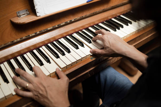 istock Man playing and composing at the piano 1481137516
