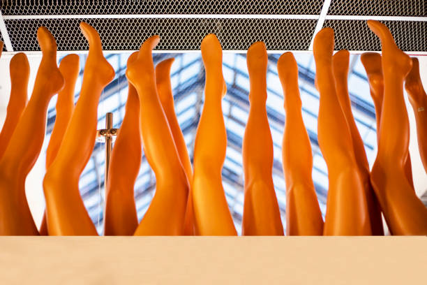 different empty brown mannequins of female legs. horizontal