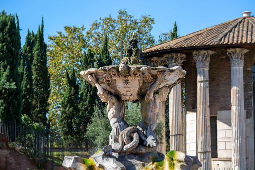 Rome, Italy - October 8, 2020:  Tritons Fountain in front of the Temple of Hercules Victor in Square of the Mouth of Truth (Piazza Bocca della Verita)