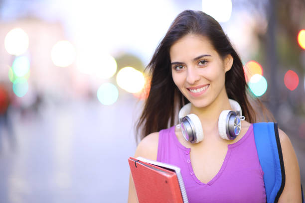 istock Happy student posing in the street 1481141952