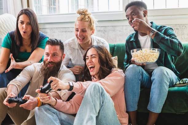 istock Mixed group of friends having fun playing video games 1481142980