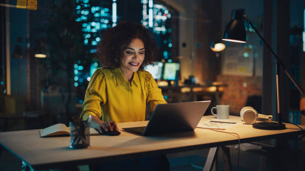 istock Expressive Multiethnic Middle Eastern Female Working on a Creative Job Position in an Advertising Company. Manager Brainstorming Ideas, Thinking on a Project. Office at Night. 1481145840